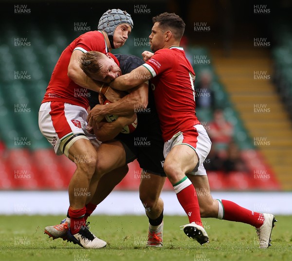 030721 - Wales v Canada - Summer Internationals - Ben Lesage of Canada is tackled by Jonathan Davies and Tomos Williams of Wales
