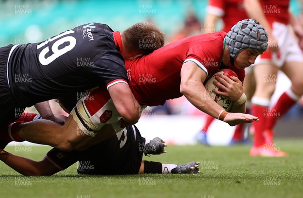 030721 - Wales v Canada - Summer Internationals - Jonathan Davies of Wales is tackled by Donald Carson and Josh Larsen of Canada