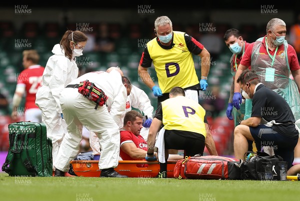 030721 - Wales v Canada, Summer International Series - Leigh Halfpenny of Wales receives treatment before being istretchered from the pitch
