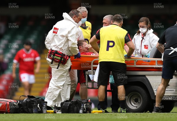 030721 - Wales v Canada, Summer International Series - Leigh Halfpenny of Wales receives treatment before being istretchered from the pitch
