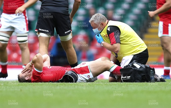 030721 - Wales v Canada, Summer International Series - Leigh Halfpenny of Wales receives treatment for an injury early in the match before being stretchered off