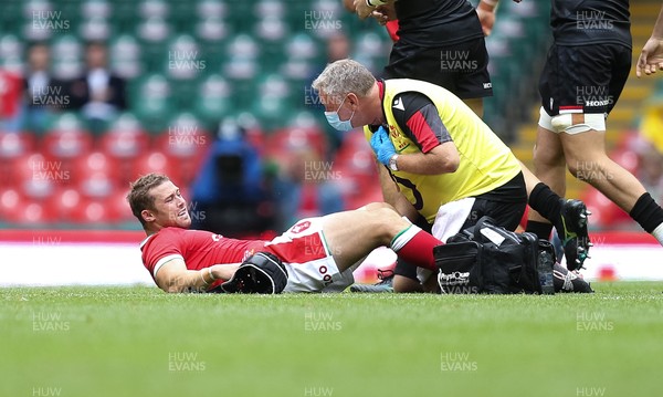 030721 - Wales v Canada, Summer International Series - Leigh Halfpenny of Wales receives treatment for an injury early in the match before being stretchered off