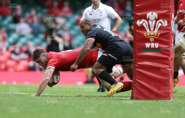 030721 - Wales v Canada, Summer International Series - Will Rowlands of Wales beats Kaiona Lloyd of Canada to score try