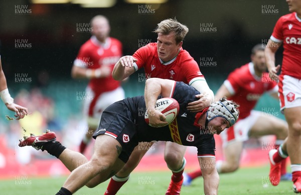 030721 - Wales v Canada, Summer International Series - Andrew Quattrin of Canada  is tackled by Nick Tompkins of Wales