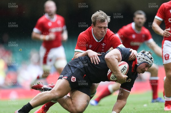 030721 - Wales v Canada, Summer International Series - Andrew Quattrin of Canada  is tackled by Nick Tompkins of Wales