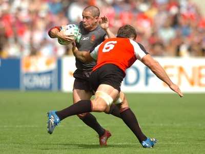 09.09.07 - Wales v Canada - Rugby World Cup 2007 - France - Wales' Shane Williams is tackled by Canada's Jamie Cudmore 