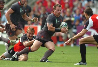 09.09.07 - Wales v Canada - Rugby World Cup 2007 - France - Wales' Matthew Rees is tackled by Canada's Mike James 