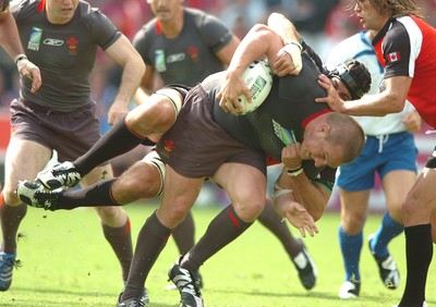 09.09.07 - Wales v Canada - Rugby World Cup 2007 - France - Wales' Gethin Jenkins is tackled by Canada's Luke Tait 