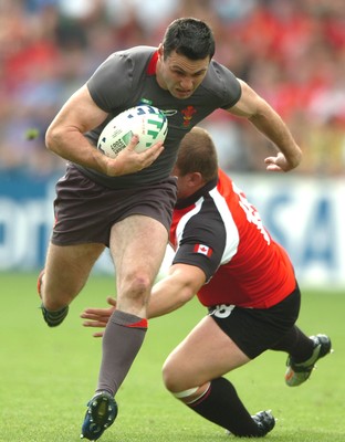 09.09.07 - Wales v Canada - Rugby World Cup 2007 - France - Wales' Stephen Jones beats Canada's Mike Burak 