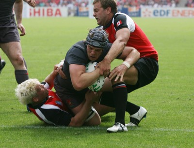 09.09.07 Wales v Canada RWC2007... Wales Alun-Wyn Jones scores try despite tackle by James pritchard and Dave Spicer. 