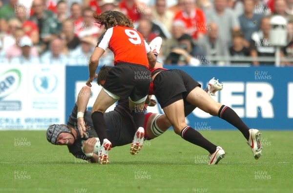 09.09.07 - Wales v Canada - Rugby World Cup 2007 - France - Wales' Alun Wyn Jones is tackled by Canada's Dth van der Merwe 