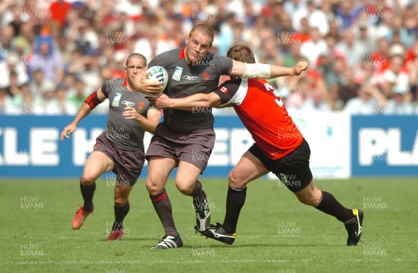 09.09.07 - Wales v Canada - Rugby World Cup 2007 - France - Wales' Gethin Jenkins is tackled by Canada's Jon Thiel 
