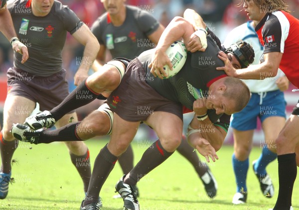 09.09.07 - Wales v Canada - Rugby World Cup 2007 - France - Wales' Gethin Jenkins is tackled by Canada's Luke Tait 
