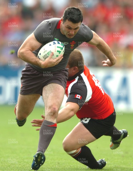 09.09.07 - Wales v Canada - Rugby World Cup 2007 - France - Wales' Stephen Jones beats Canada's Mike Burak 
