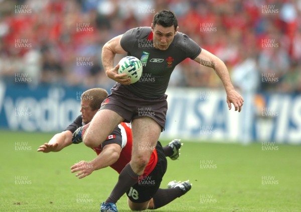 09.09.07 - Wales v Canada - Rugby World Cup 2007 - France - Wales' Stephen Jones beats Canada's Mike Burak 