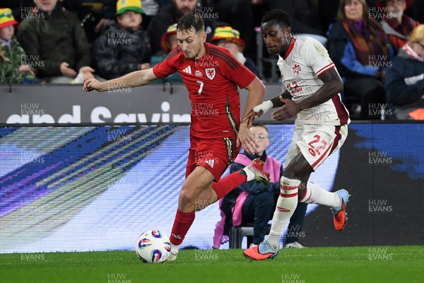 090925 - Wales v Canada -  International Friendly - David Brooks of Wales is challenged by Richie Laryea of Canada
