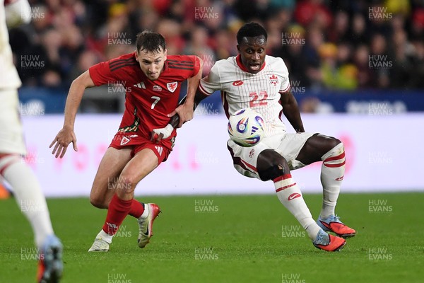 090925 - Wales v Canada -  International Friendly - David Brooks of Wales is challenged by Richie Laryea of Canada
