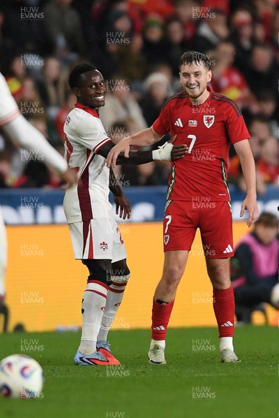 090925 - Wales v Canada -  International Friendly - David Brooks of Wales and Richie Laryea of Canada exchange a joke 
