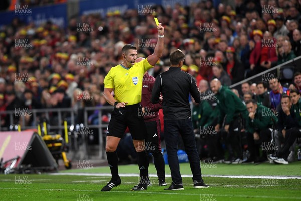 090925 - Wales v Canada -  International Friendly - Referee Robert Jones shows Jesse Marsch, Canada Manager a yellow card