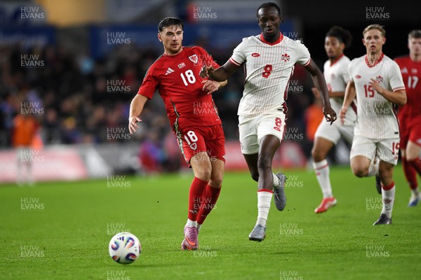 090925 - Wales v Canada -  International Friendly - Mark Harris of Wales is challenged by Ismael kone of Canada