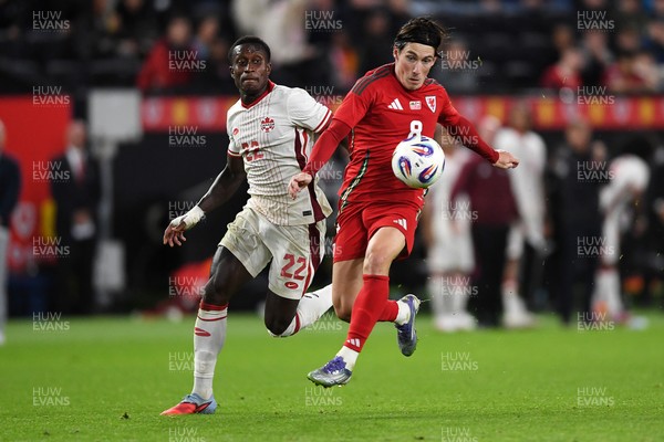 090925 - Wales v Canada -  International Friendly - \e8\ is challenged by Richie Laryea of Canada