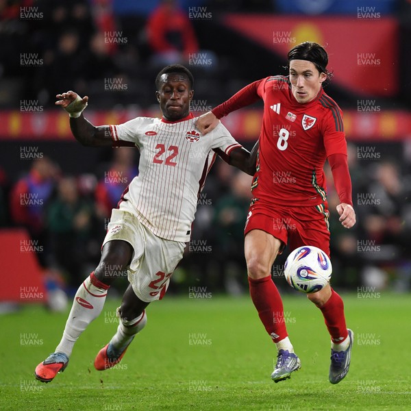 090925 - Wales v Canada -  International Friendly - \e8\ is challenged by Richie Laryea of Canada