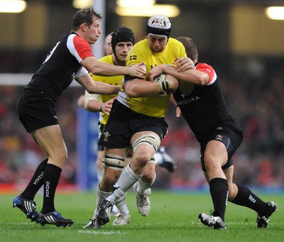 14.11.08 - Wales v Canada -  Invesco Perpetual Series 2008 - Wales' Ryan Jones is tackled by Canada's Ander Monro and Mike Pletch.  