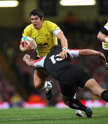 14.11.08 ... Wales v Canada, Invesco Perpetual International 2008 Wales' James Hook  is tackled by Canada's Bryn Keys  