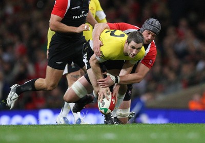 14.11.08 ... Wales v Canada, Invesco Perpetual International 2008 Wales' Andrew Bishop is tackled by Canada's Mike Burak  