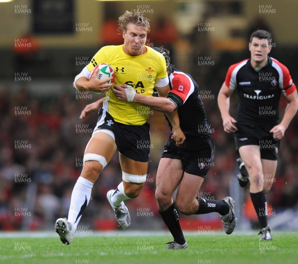 14.11.08 - Wales v Canada -  Invesco Perpetual Series 2008 - Wales' Andy Powell is tackled by Canada's Ryan Smith.  