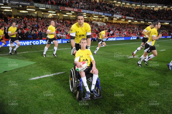 14.11.08 - Wales v Canada -  Invesco Perpetual Series 2008 - Ryan Jones leads out his Welsh team with mascot Alex Evans. 