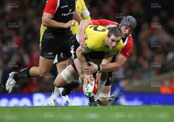 14.11.08 ... Wales v Canada, Invesco Perpetual International 2008 Wales' Andrew Bishop is tackled by Canada's Mike Burak  