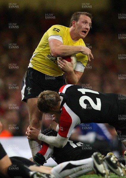 14.11.08 ... Wales v Canada, Invesco Perpetual International 2008 Wales' Morgan Stoddart is tackled by Canada's Matt Evans  