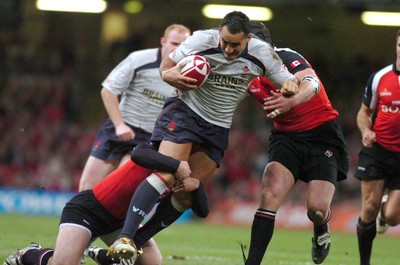 17.11.06 - Wales v Canada - Invesco Perpetual Series 2006 - Wales' Sonny Parker is tackled by David Spicer and Stan McKeen(R) 