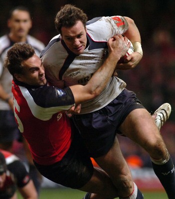 17.11.06 - Wales v Canada - Invesco Perpetual Series 2006 - Wales' Mark Jones is tackled by Ed Fairhurst 