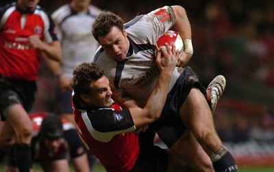 17.11.06 - Wales v Canada - Invesco Perpetual Series 2006 - Wales' Mark Jones is tackled by Ed Fairhurst 