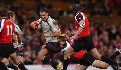 17.11.06  Wales v Canada  Wales Sonny Parker is tackled by David Spicer 