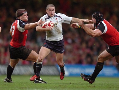 17.11.06  Wales v Canada  Wales Shane Williams is tackled by Forrest Gainer and Kevin Tkachuk  