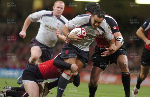 17.11.06 - Wales v Canada - Invesco Perpetual Series 2006 - Wales' Sonny Parker is tackled by David Spicer and Stan McKeen(R) 