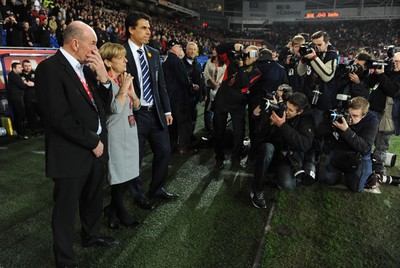 290212 - Wales v Costa Rica -Wales manager Chris Coleman looks on during the national anthems with Gary Speed's parents Roger and Carol