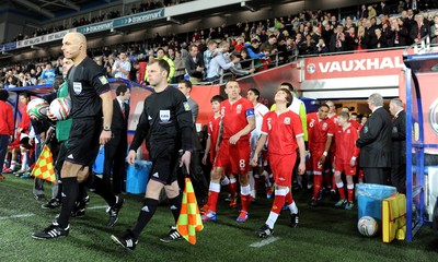 290212 - Wales v Costa Rica -Gary Speed's sons Ed and Tommy lead out Wales with captain Craig Bellamy and Aaron Ramsey