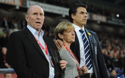 290212 - Wales v Costa Rica -Wales manager Chris Coleman looks on during the national anthems with Gary Speed's parents Roger and Carol