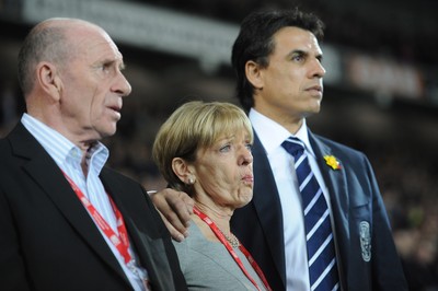 290212 - Wales v Costa Rica -Wales manager Chris Coleman looks on during the national anthems with Gary Speed's parents Roger and Carol