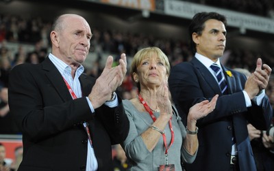 290212 - Wales v Costa Rica -Wales manager Chris Coleman looks on during the national anthems with Gary Speed's parents Roger and Carol