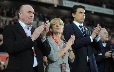 290212 - Wales v Costa Rica -Wales manager Chris Coleman looks on during the national anthems with Gary Speed's parents Roger and Carol