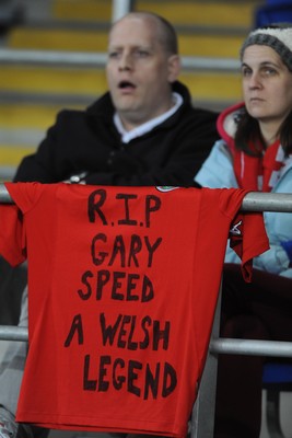 290212 - Wales v Costa Rica -Wales fans look on with a Gary Speed message