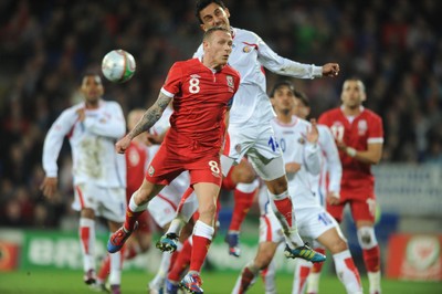 290212 - Wales v Costa Rica -Craig Bellamy of Wales and Randall Azofeifa of Costa Rica compete