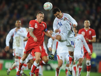 290212 - Wales v Costa Rica -Craig Bellamy of Wales and Randall Azofeifa of Costa Rica compete