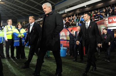 290212 - Wales v Costa Rica -Mark Hughes and Ryan Giggs walk onto the pitch during half time of the Gary Speed memorial match