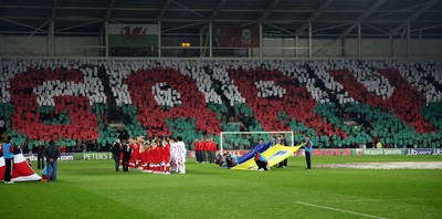 290212 - Wales v Costa Rica, The Gary Speed Memorial Match, Cardiff - Fans spell out Gary's name during the singing of the National Anthem at the start of the match 